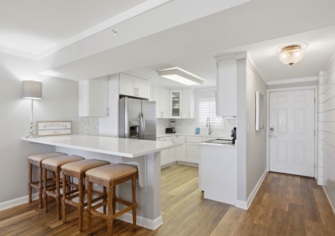 Sandy Key 827- Gather at the bright breakfast bar or whip up your favorite meals in your fully equipped kitchen with modern appliances and plenty of counter space.