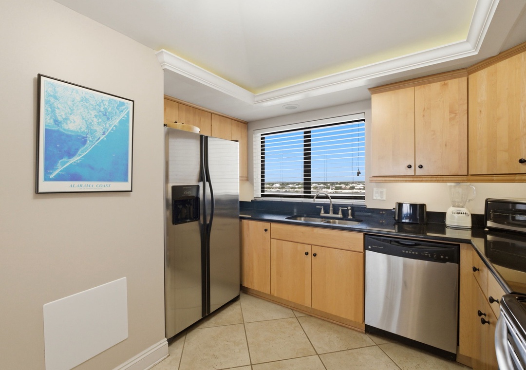 Shipwatch D803- Cook with ease in this fully equipped kitchen featuring stainless steel appliances, ample counter space, and natural light for your culinary adventures.