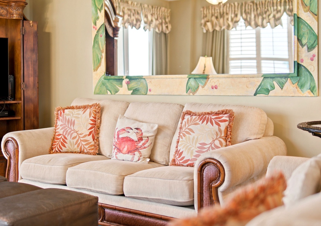 Beach Colony W13A- Sink into plush coastal charm with a welcoming sofa adorned with tropical throw pillows, perfect for your seaside retreat.