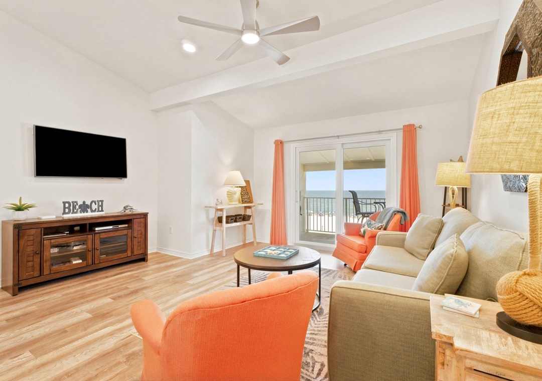 Gulfside Villas 2B- Sink into the cozy sofa, flip on your favorite show, and catch glimpses of the ocean breeze through the balcony doors—your perfect place to unwind.