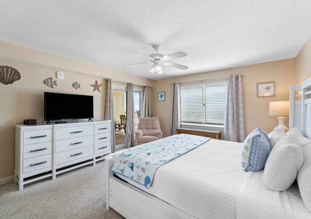 Sandy Key 628- Unwind in your serene coastal retreat, where crisp white linens and calming ocean-inspired accents await. A soft reading chair, bright natural light, and thoughtful decor ensure your perfect escape by the shore.