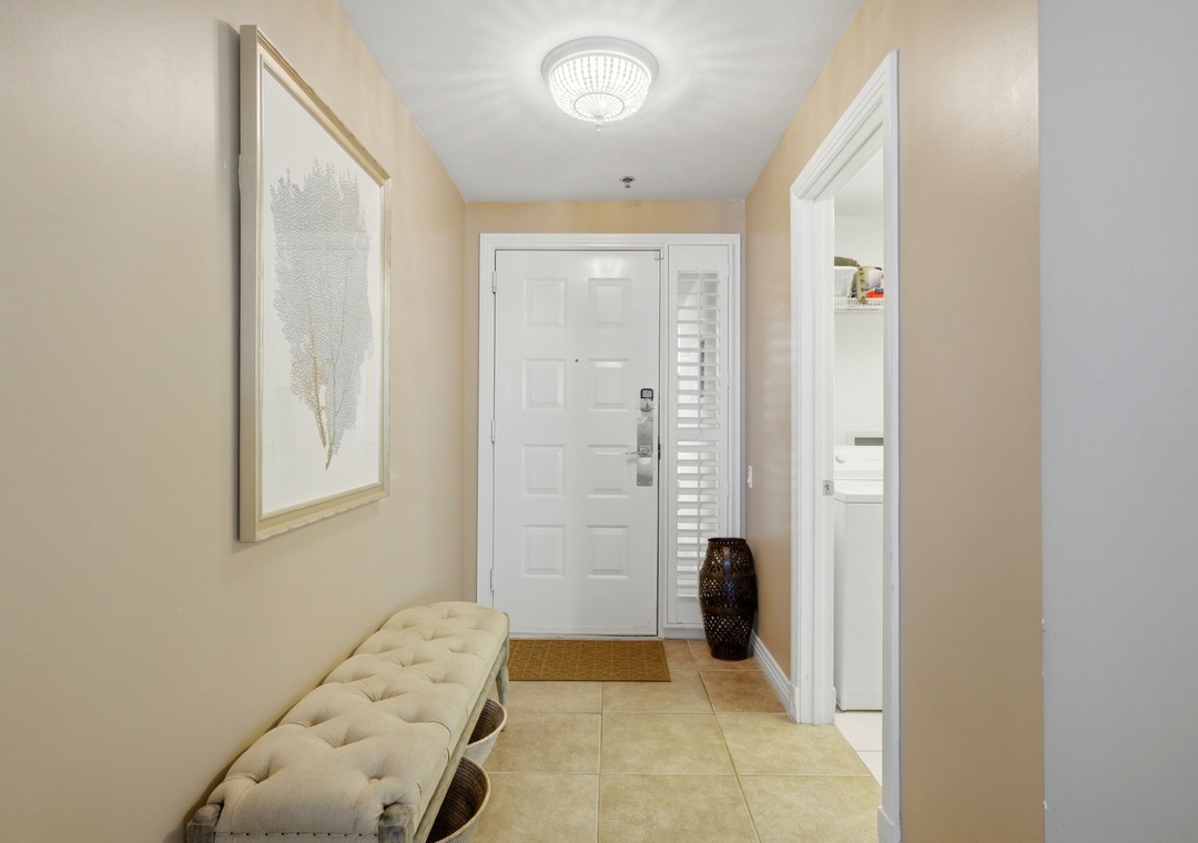 Beach Colony T PH1D- Step inside your welcoming entryway, where soft neutral tones and elegant decor create a peaceful first impression. A cozy bench invites you to settle in comfortably as you arrive.