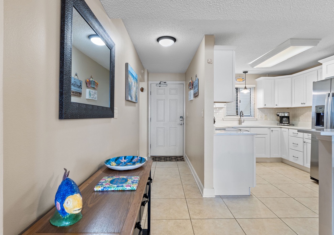 Sandy Key 628- Step into your welcoming entry, where coastal charm meets modern comfort—a bright, open space flows seamlessly into your fully equipped kitchen, ready for holiday feasts and morning coffee.