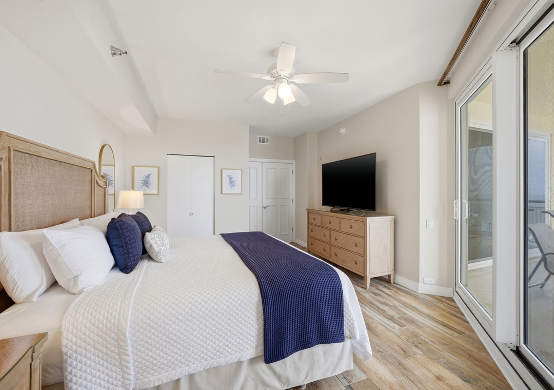 Beach Colony Tower PH1B -Your coastal retreat features crisp linens, soothing blues, and natural wood tones creating a serene escape. Step through the balcony doors to enjoy ocean breezes and unwind in comfort.