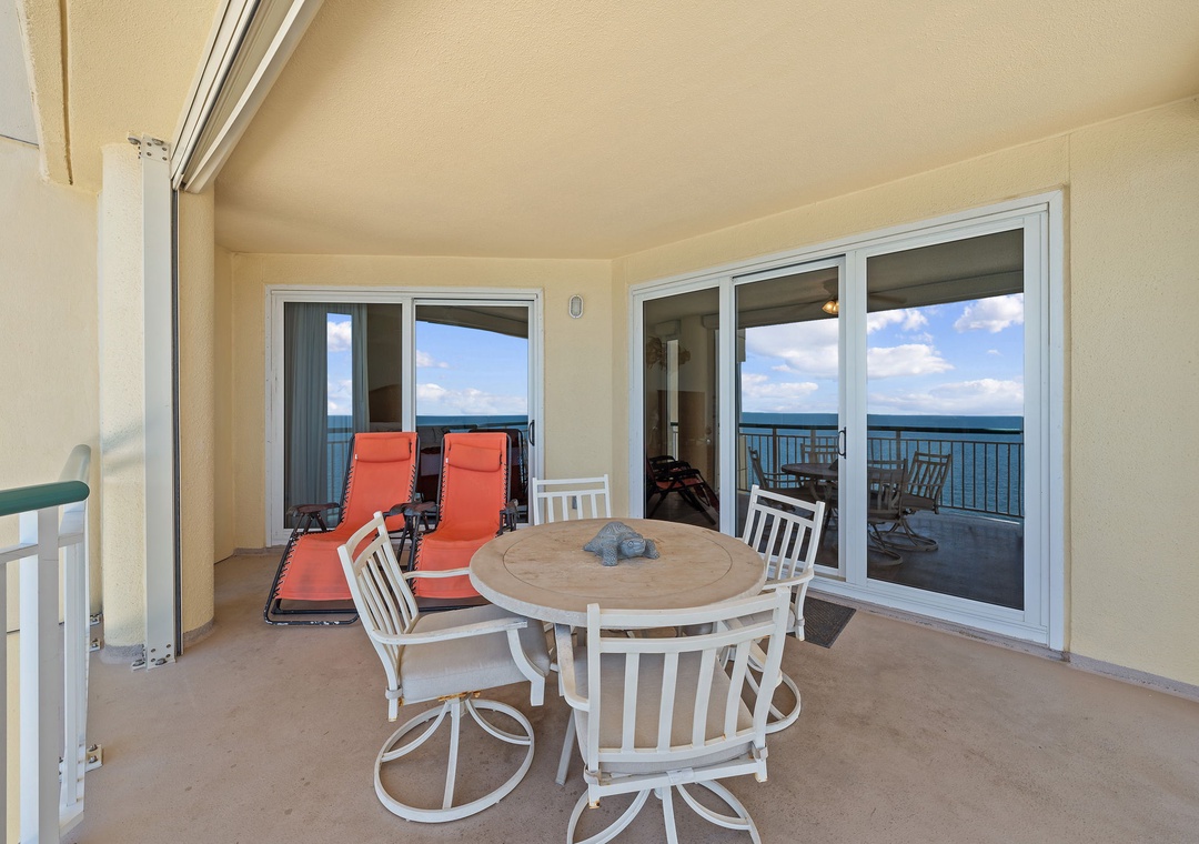 Beach Colony T15B- Step onto your private balcony where bright coral lounge chairs invite you to soak up the sun while dining al fresco at your own seaside table.