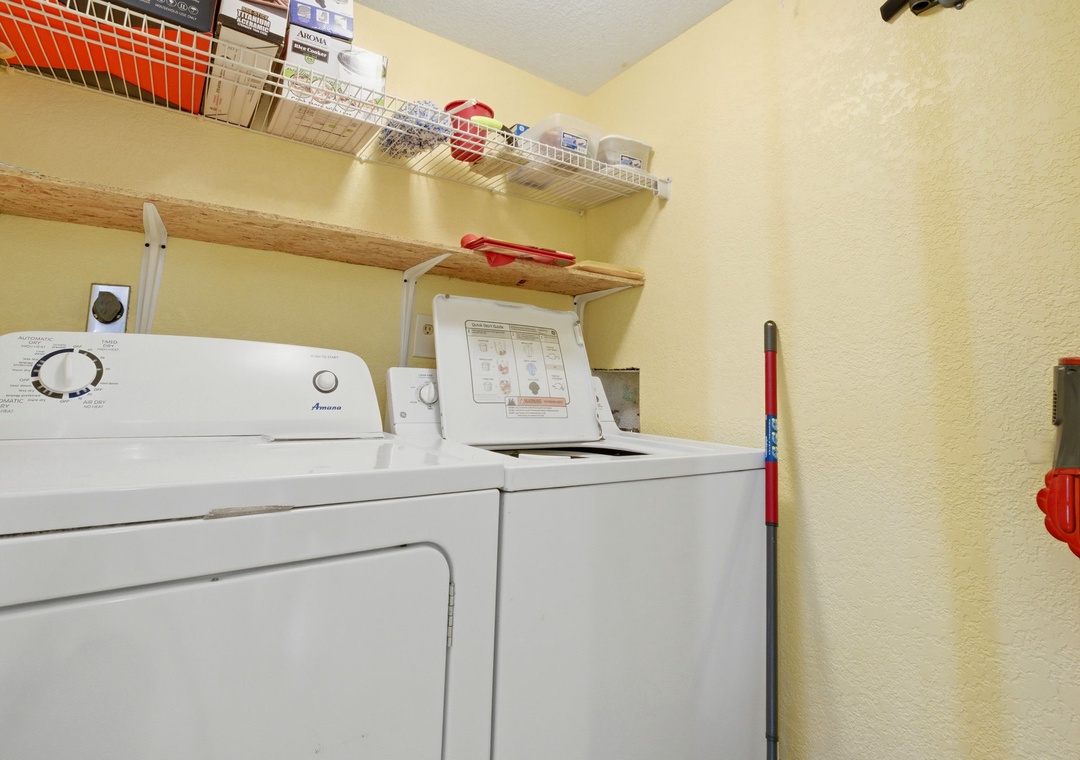Ocean Breeze E601- Your personal laundry room features a full-size washer and dryer with organized shelving above, making it easy to keep your vacation wardrobe fresh throughout your stay.