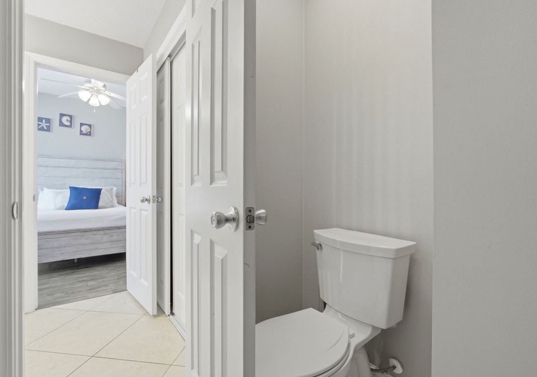 Lighthouse 418- A private powder room just steps from your bedroom, with a soft neutral palette and clean, modern fixtures for your comfort.