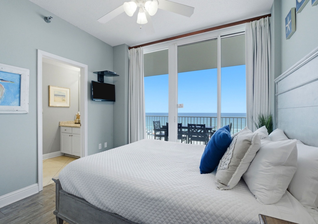 Lighthouse 418- Wake up to breathtaking ocean views from your private balcony, where the sea stretches endlessly beyond comfortable outdoor seating. Inside, soft coastal hues and crisp linens create your perfect beachfront retreat.