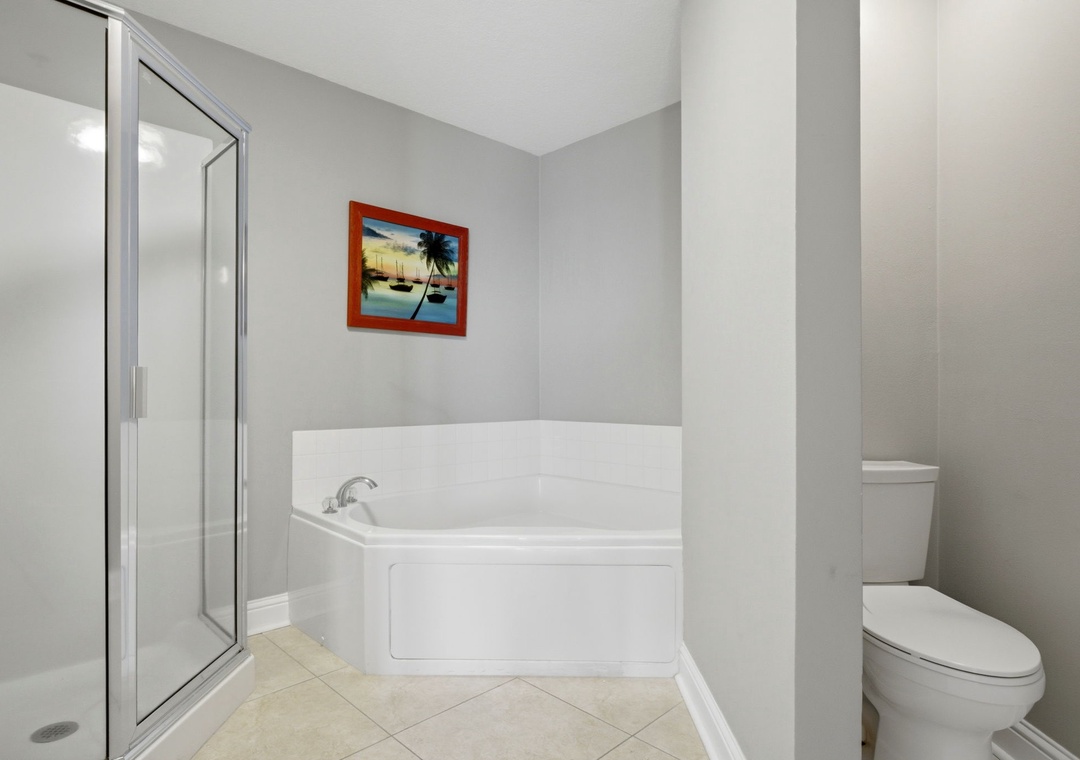 Lighthouse 418- Relax in your private soaking tub after a long day, then refresh in the separate glass-enclosed shower. The clean, modern space makes it easy to unwind.