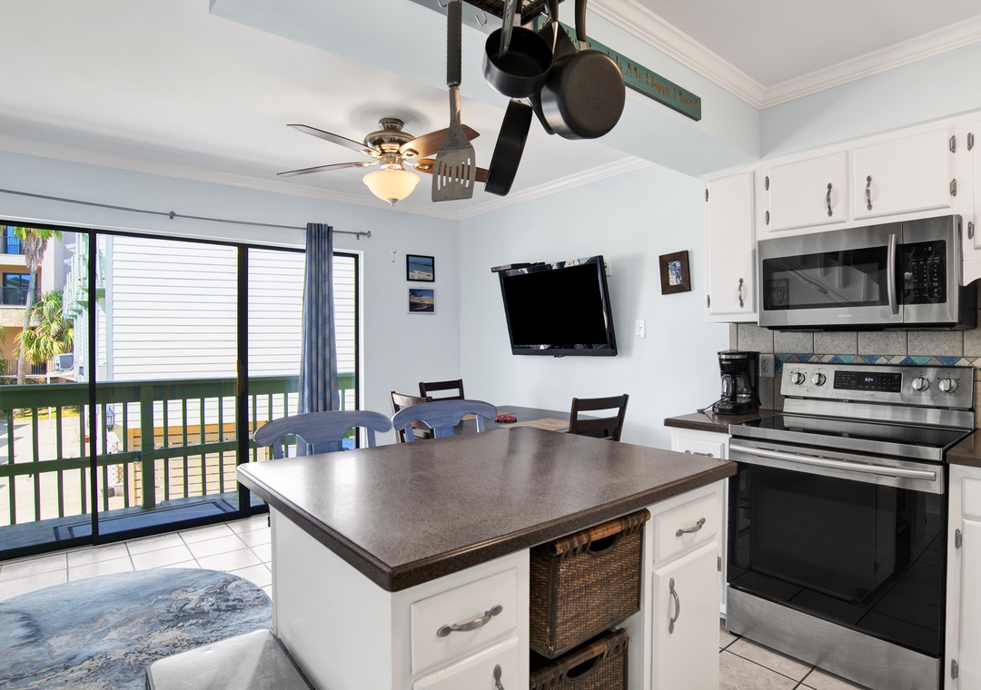 Kitchen View to Dining Area & Balcony