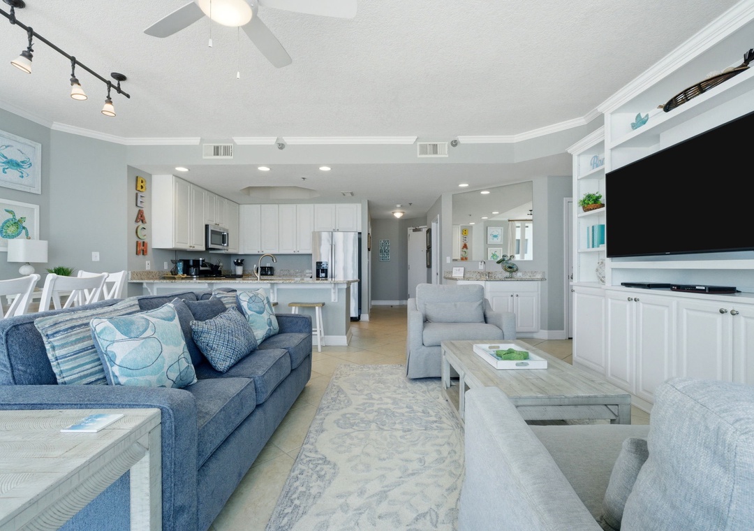Lighthouse 418- Relax in your bright coastal haven where ocean breezes meet elegant comfort. The open layout invites you to unwind on plush seating while preparing meals and enjoying togetherness.