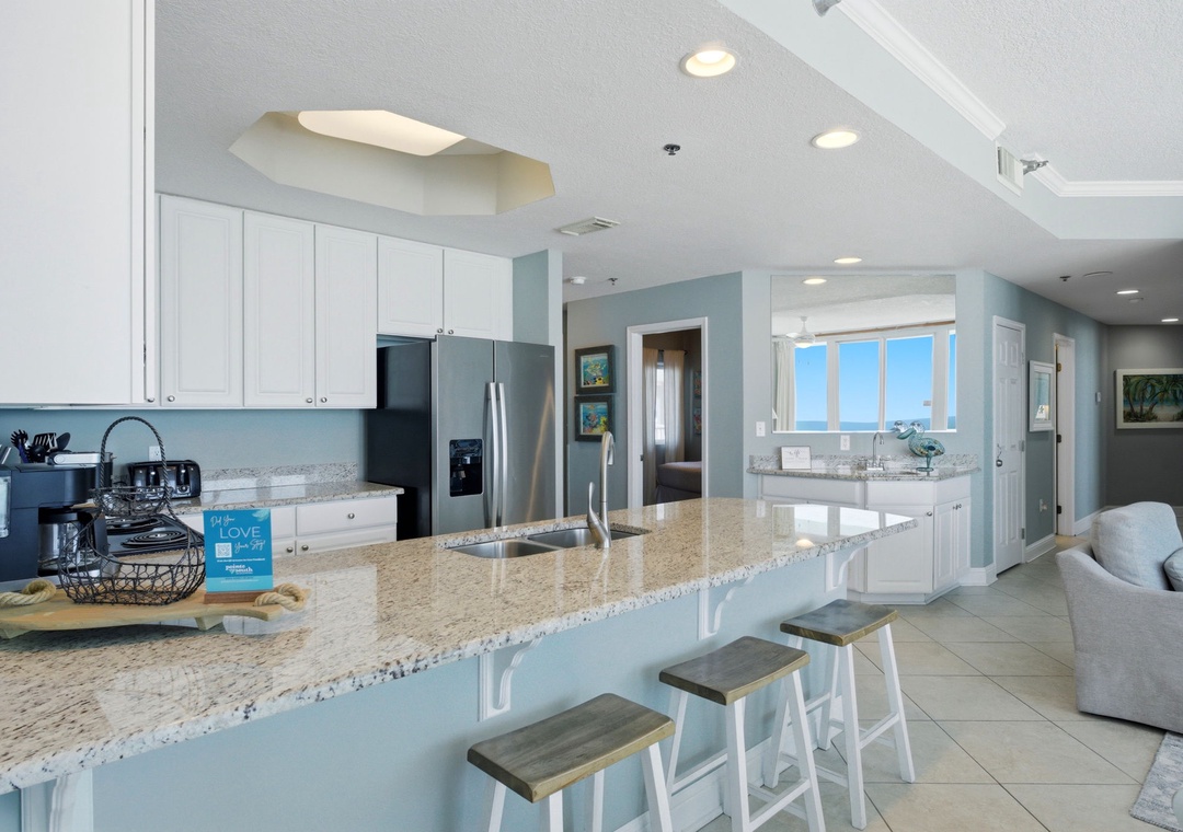 Lighthouse 418- Picture yourself preparing meals in this bright, spacious kitchen with gleaming granite counters, modern appliances, and stunning sea views that make every moment feel like a coastal escape.