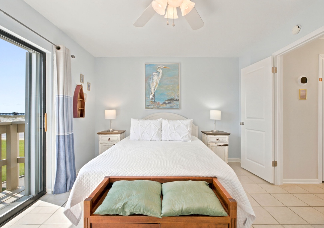 Drift off in this serene coastal bedroom with soft white linens and gentle beach decor. Your private balcony awaits just steps away for morning coffee or sunset views.