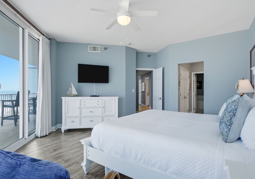 Lighthouse 418- Drift off to the soothing blue hues and coastal charm of your bedroom retreat, where a private balcony invites you to savor ocean breezes and stunning waterfront views.