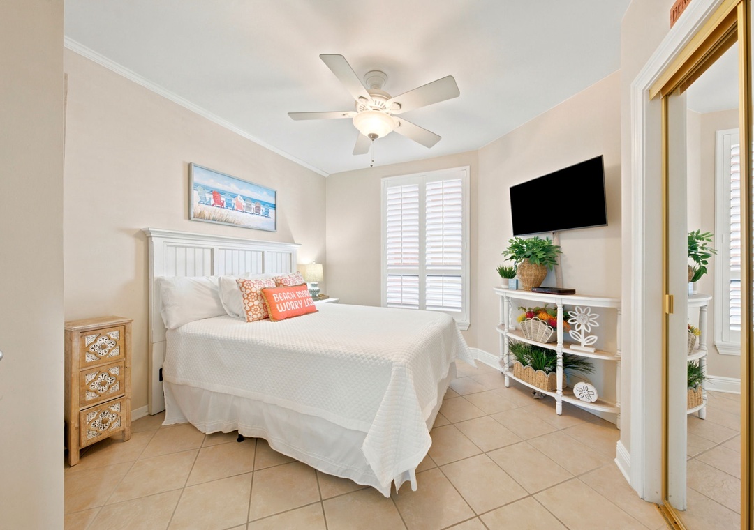 SeaChase 1104C- Drift off in your serene coastal bedroom, where crisp linens, a gentle ceiling fan, and beachy accents create your perfect retreat after sun-filled days.
