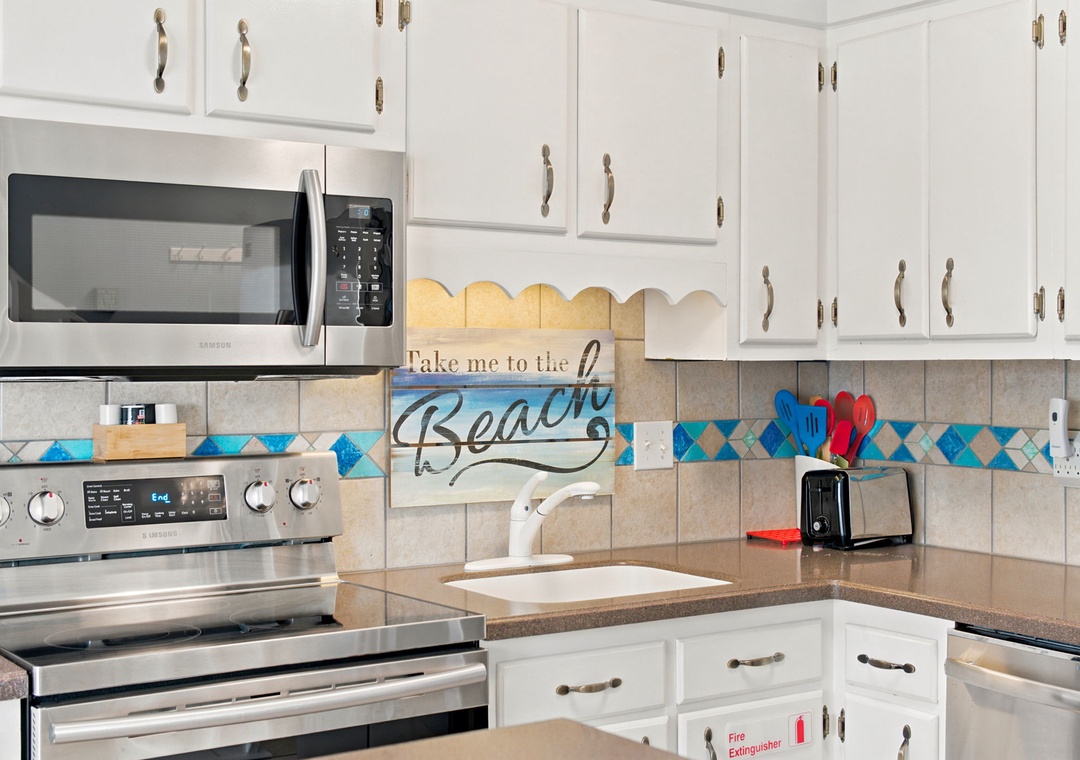 Your fully-equipped kitchen features stainless appliances, ample counter space, and cheerful beach-inspired décor to inspire delicious home-cooked meals during your stay.