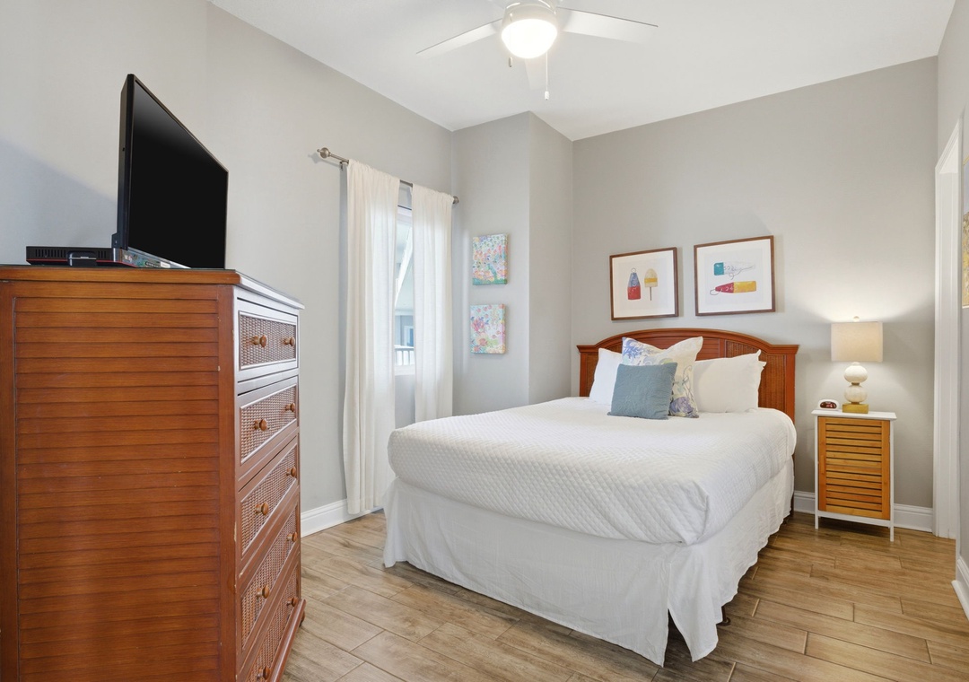 Lighthouse 418- Step into your bright, airy bedroom where vaulted ceilings and a soft coastal palette create instant calm. Sink into crisp linens, unwind with your favorite shows, and let gentle breezes from the window lull you to sleep.
