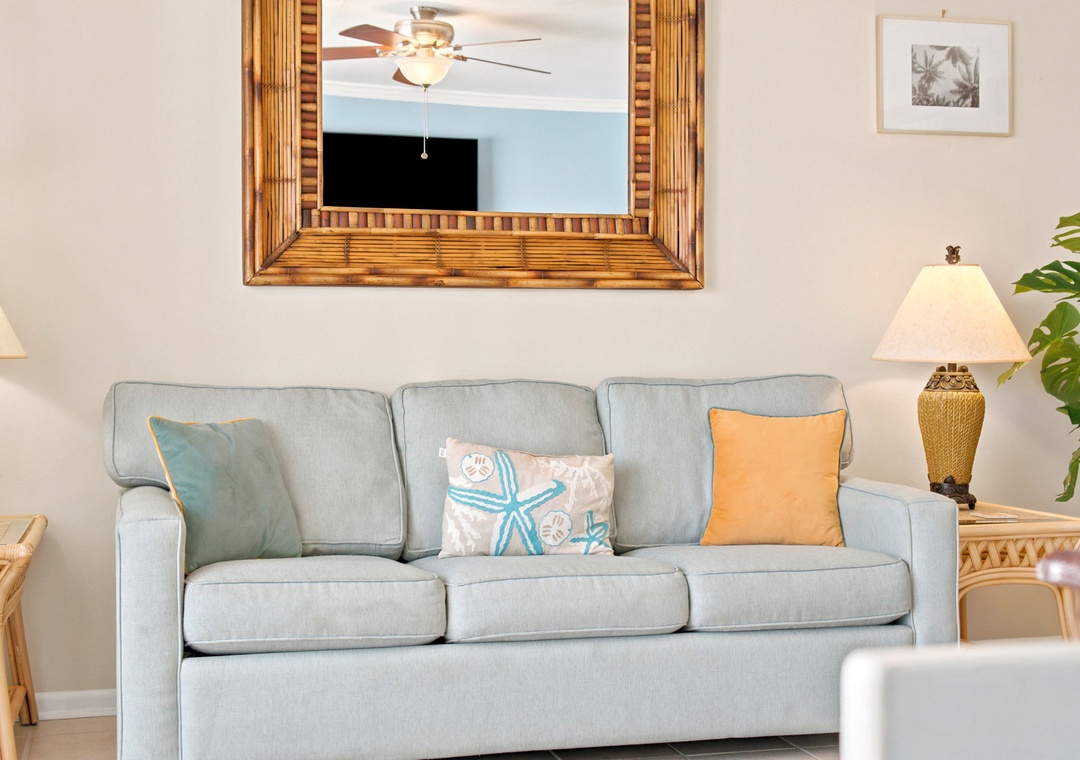 Sink into coastal comfort on your spacious sofa, where beach-inspired accents and soft lighting create the perfect retreat after a day of sun and adventure.