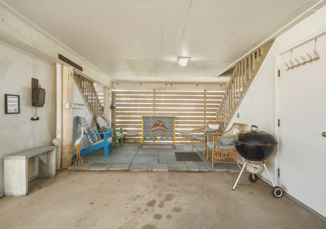 Step into your private outdoor retreat featuring cozy seating, a BBQ grill ready for grilling, and a welcoming Margaritaville vibe. This covered space is perfect for relaxing or entertaining day or night.