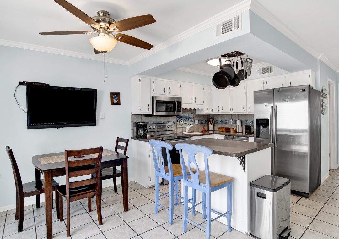 Kitchen & Dining Room View with TV