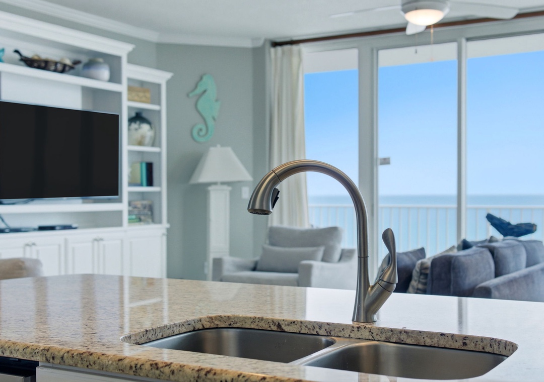 Lighthouse 418- Coastal charm meets comfort with an open kitchen flowing into a bright living space, complete with stunning ocean views through the balcony doors for your seaside retreat.
