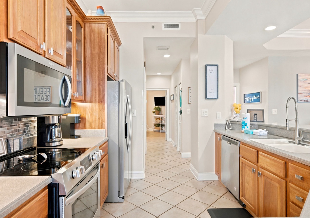 SeaChase 1104C-Your fully-equipped galley kitchen invites you to prepare meals with ease. Stainless appliances, warm wood cabinetry, and ample counter space create a comfortable and functional cooking environment.