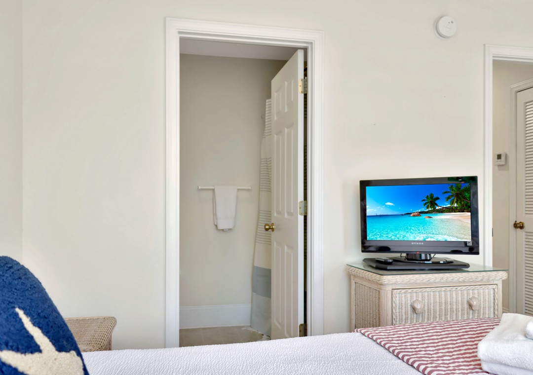 Bedroom 2 with TV and Master Bathroom
