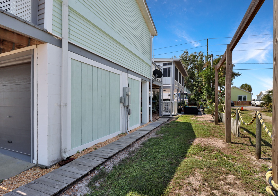Walkway to Backyard with Main Entrance