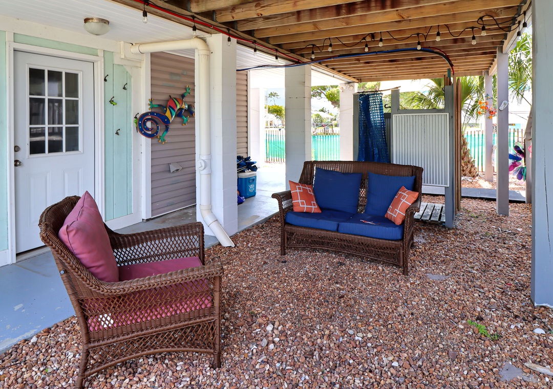 Sitting Area Under House with Outdoor Shower