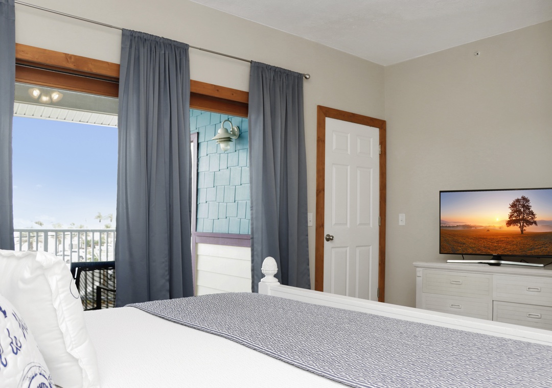 Bedroom 1 with TV and Covered Deck