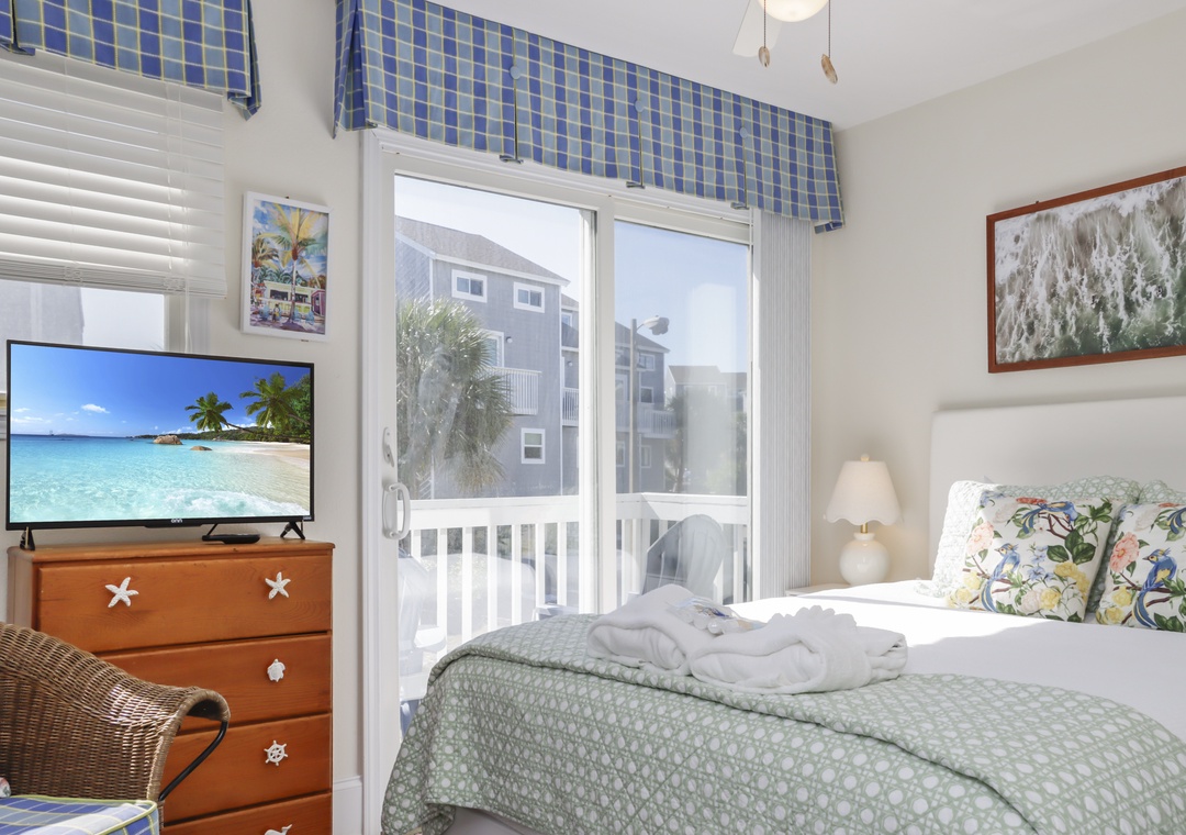 Bedroom 1 with TV and Deck