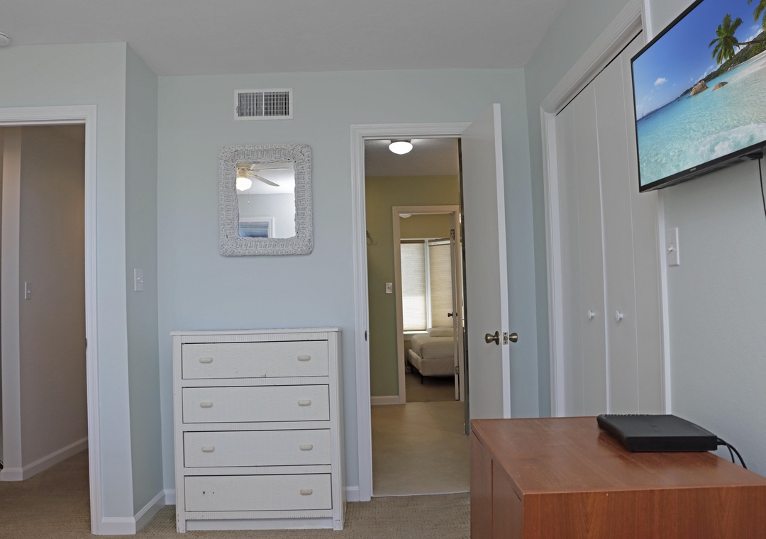 Bedroom 1 with TV and Shared Bathroom