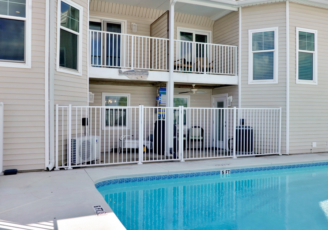 Back Exterior with Two Decks Overlooking Pool