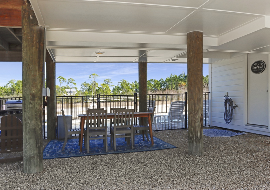Outdoor Dining Under House and Laundry Room