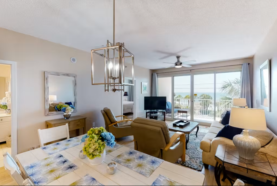 Open dining and living area with Gulf views and easy access to the private balcony.