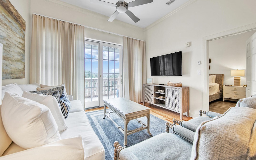 Living room with flat-screen tv and access to balcony