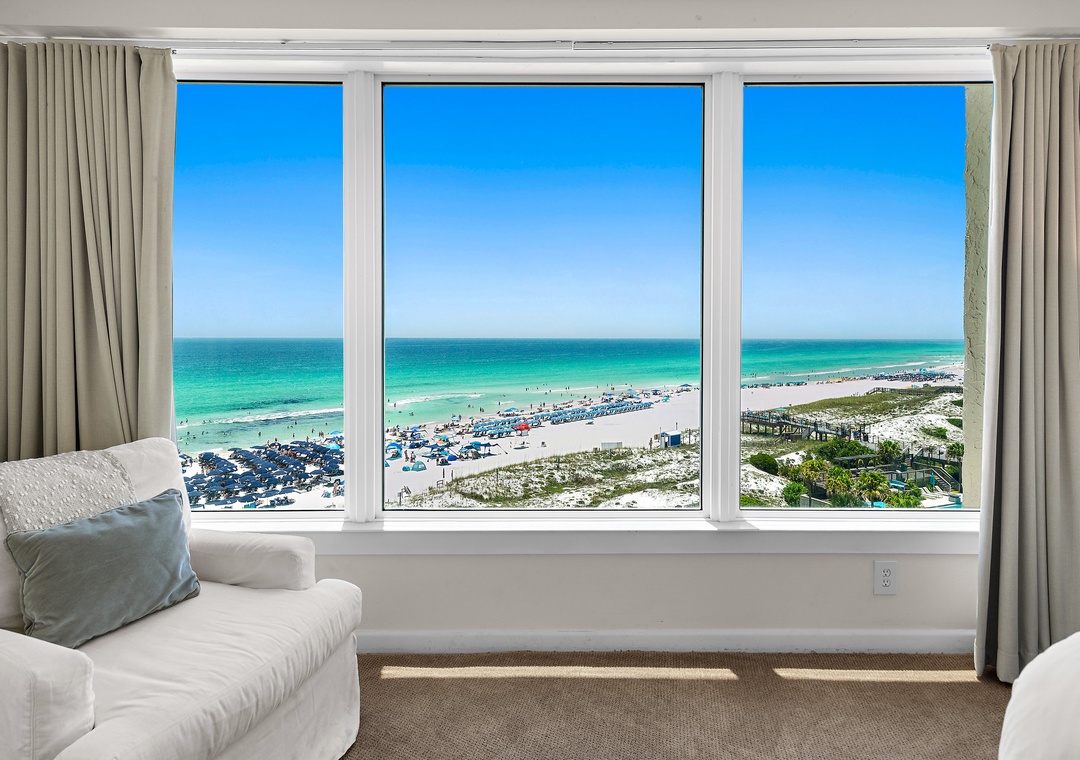 Wall of windows showcasing spectacular Gulf views in the primary bedroom
