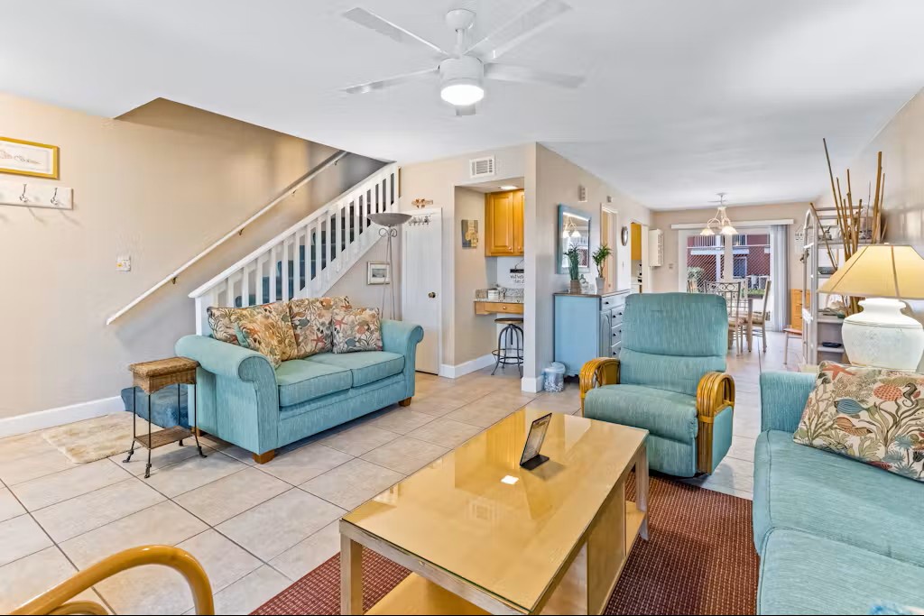 Coastal living space with cozy seating and easy access to the kitchen