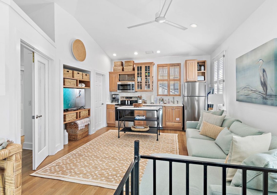 Combines the kitchen and living areas into comfortable gathering space