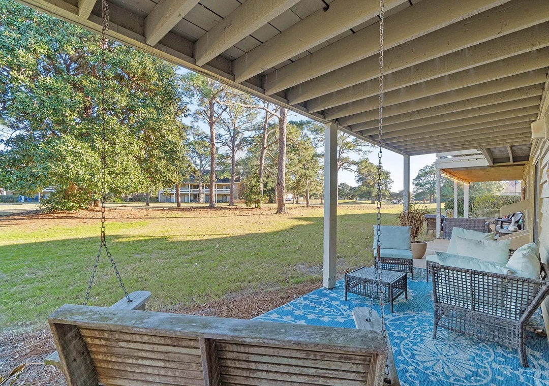 Ground level patio with porch swing