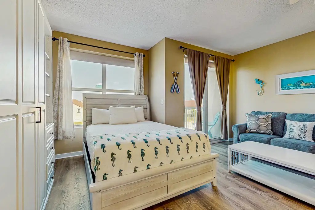 Welcome to Palm Court Yacht Club 312A Living Area and Bed