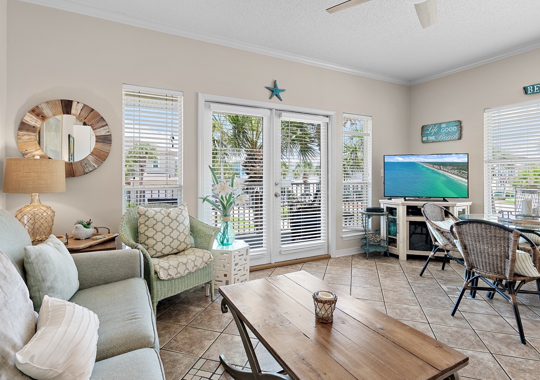 Cozy, charming living room with balcony access