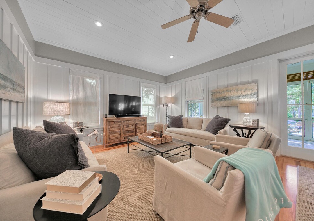 Spacious living room with TV