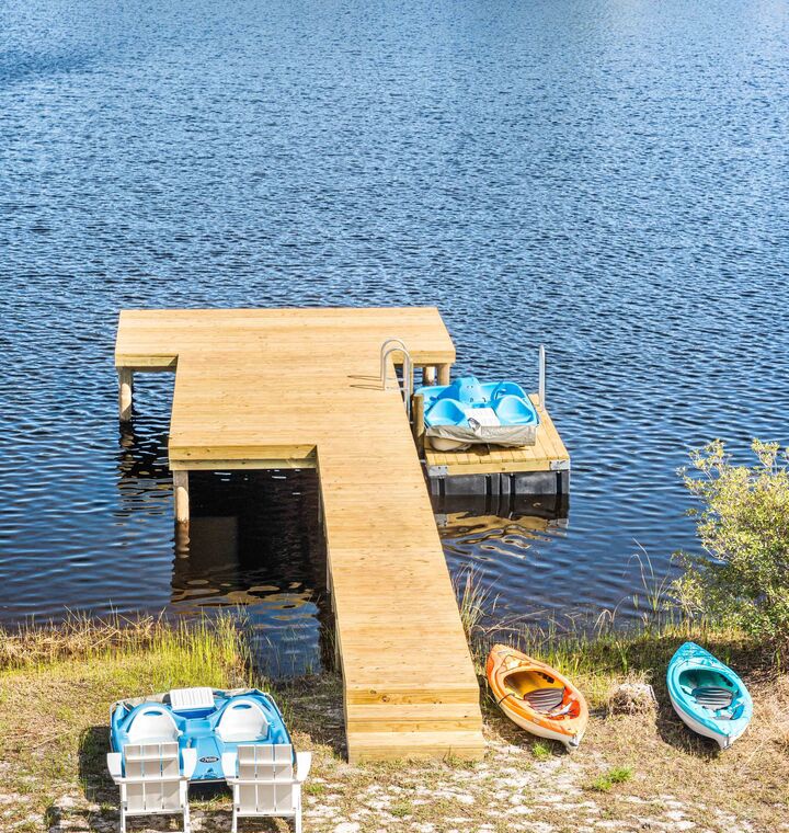 Launch a kayak or pedal boat from the private dock for a peaceful afternoon on the lake