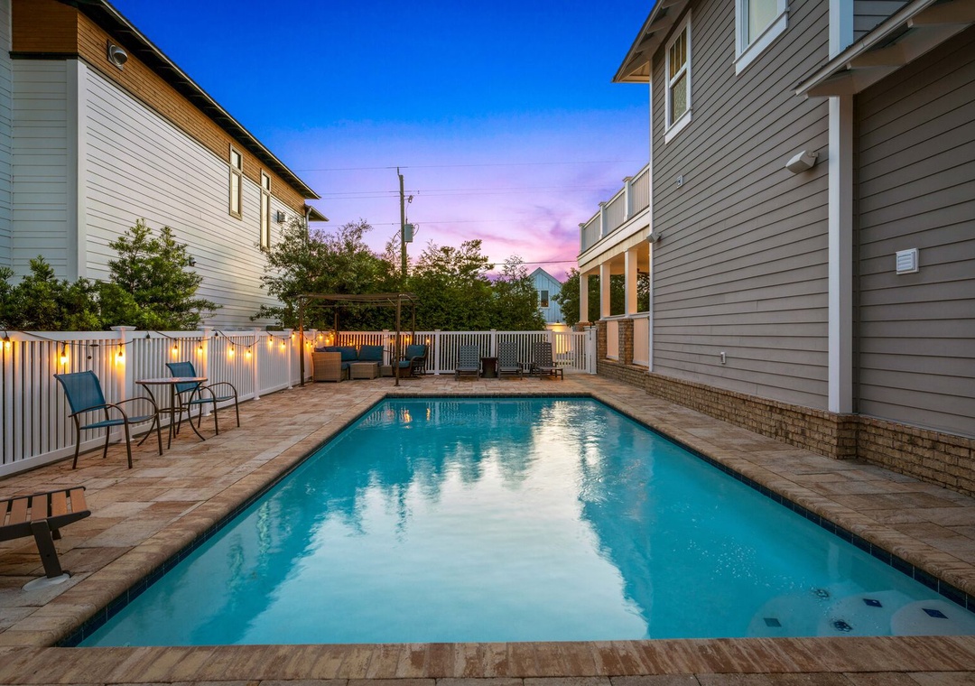Evening view of the private heated pool, perfect for relaxing after a day at the beach