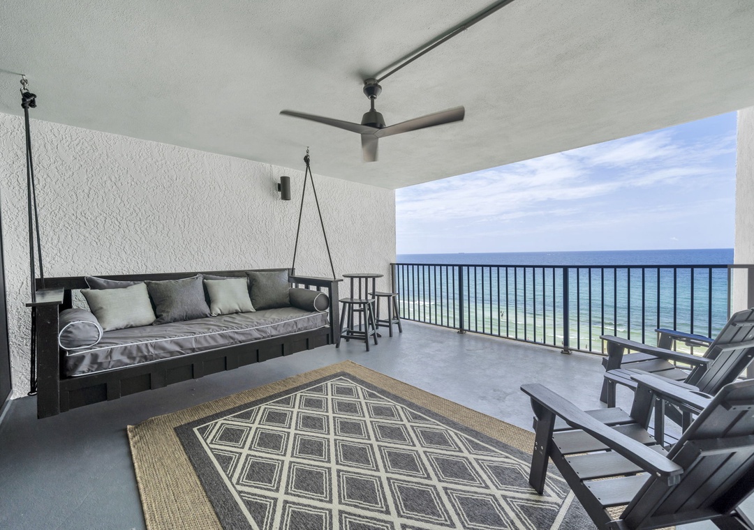 Large Covered balcony with hanging day bed
