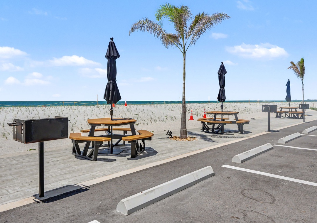 Beachside picnic & BBQ area with umbrellas