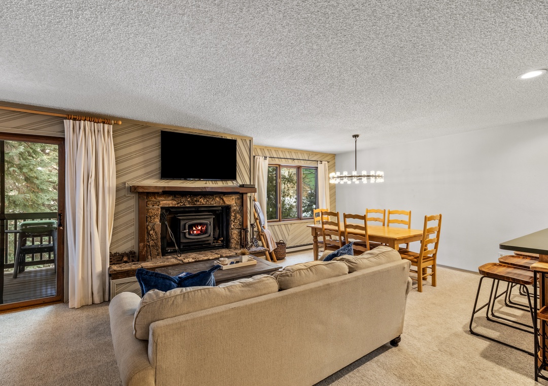 Cozy up by your stone fireplace while watching TV, then gather around the dining table for memorable meals together.