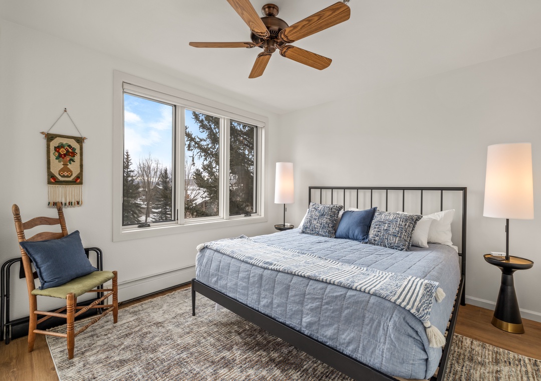 Your peaceful bedroom features a comfortable bed with soft linens, gentle lighting, and natural views to help you unwind.