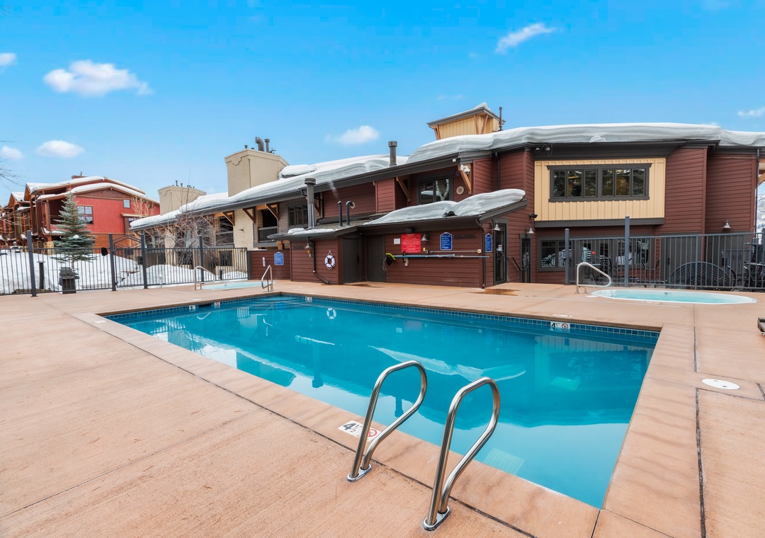 An outdoor pool surrounded by mountain-view buildings awaits at this property, offering a refreshing spot to unwind after exploring the surrounding area.
